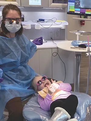 dental therapist provides pediatric treatment